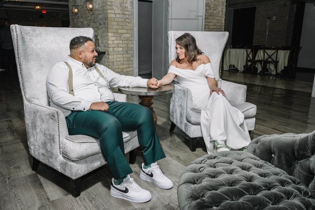 neuro-friendly wedding reception with bride and groom holding hands