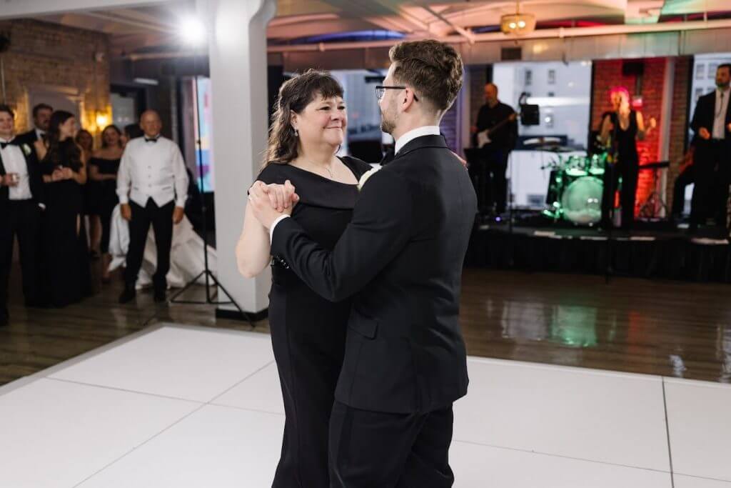 mother dancing with neurodivergent son at his wedding