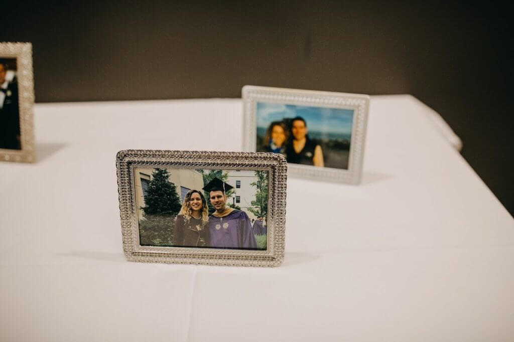 photos on table at a graduation party